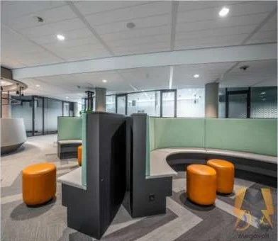 Completed open-plan office fit-out in Al Barsha with booth seating and glass partitions